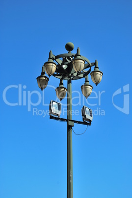 Ancient lamp on sidewalk