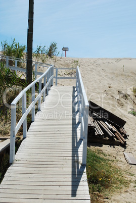 White boardwalk to local beach