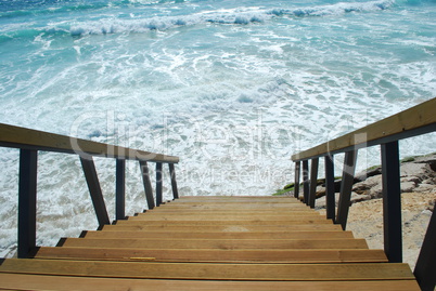 Wooden stairs or path to the bright ocean