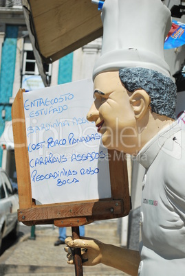 Chef holding whiteboard menu