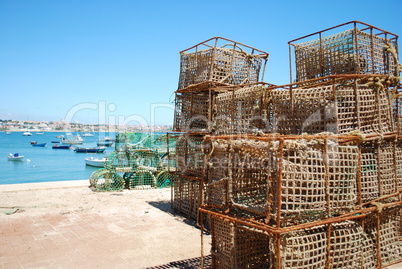 Old fishing cages in the port of Cascais, Portugal