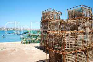 Old fishing cages in the port of Cascais, Portugal