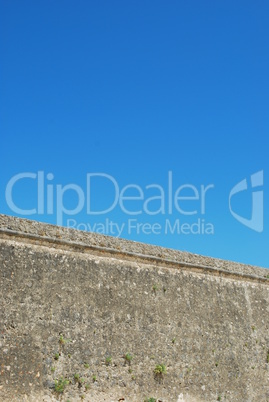 Ancient stonewall with sky background