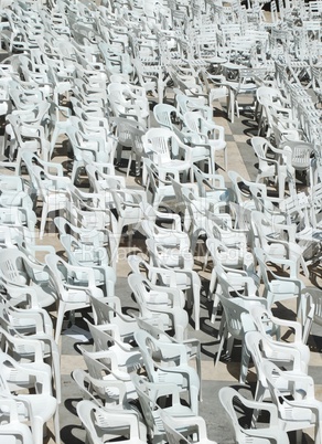White plastic chairs background