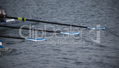 Oars lie on water.