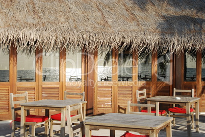 Beach restaurant view in Maldives (ocean reflection)