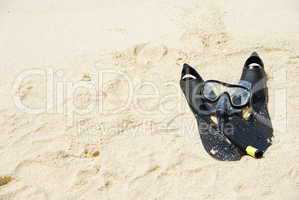 Snorkel equipment on a tropical sandy beach