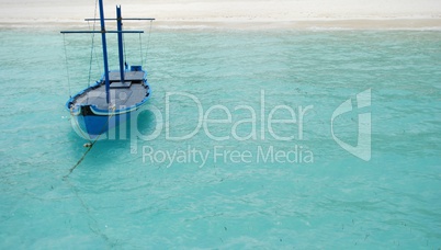 Typical Maldivian boat on blue ocean