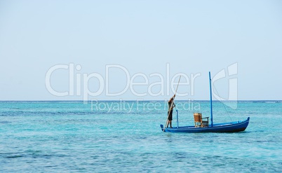 Typical Maldivian boat on blue ocean