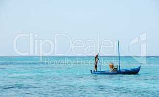 Typical Maldivian boat on blue ocean