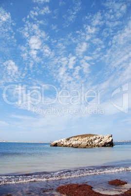 Huge rock at Baleal beach (dramatic cloudscape)