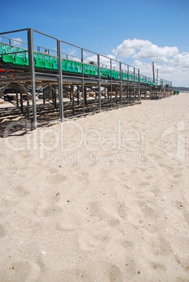 Stadium green bleachers (space on sand)