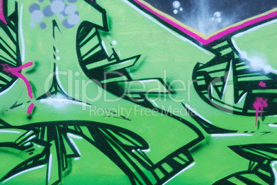 Segment of a colorful graffiti on a wall