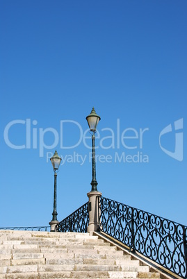 Vintage stairway with traditional lamp post (blue sky)