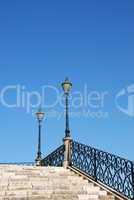 Vintage stairway with traditional lamp post (blue sky)