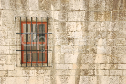 Window with bars of a medieval building