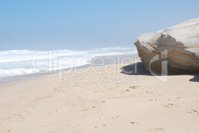 Small cliff at a beautiful beach in Praia del Rey