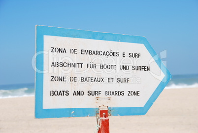 Boat and Surf sign at the beach