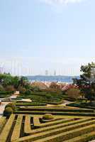 Enchanted Ajuda garden with April 25th bridge in Lisbon, Portugal
