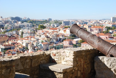 Cityscape of Lisbon in Portugal with cannon weapon