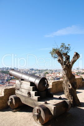 Cityscape of Lisbon in Portugal with cannon weapon