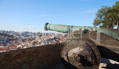 Cityscape of Lisbon in Portugal with cannon weapon