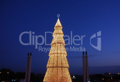 Beautiful tall Christmas tree in Lisbon (at sunset)