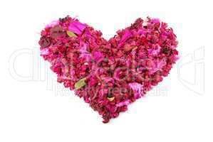 Pink heart made of dried petals, leaves, flowers for Valentine's Day