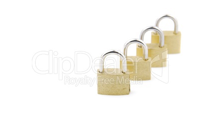 Golden closed padlocks on white