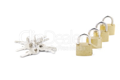 Golden closed padlocks with keys on white