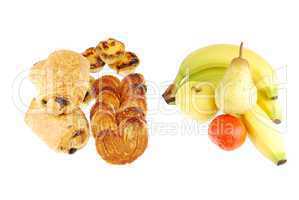 Healthy vs unhealthy (baked goods and fruits on white)