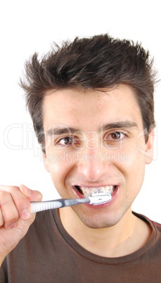 Cute guy washing his teeth