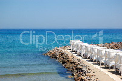 Huts at the beach of luxury hotel, Crete, Greece