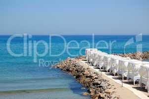 Huts at the beach of luxury hotel, Crete, Greece