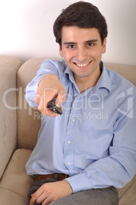 Smiling man watching tv