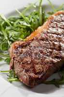 grilled loin steak on rocket salad