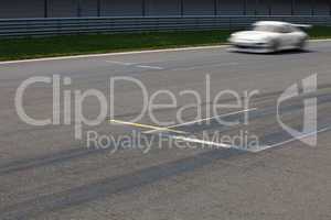 Race car passing finnish Line