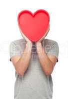 Casual man holding heart