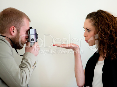 Photographer and a funny beautiful girl model