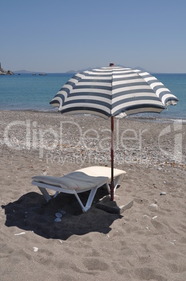 Beach umbrella and chair