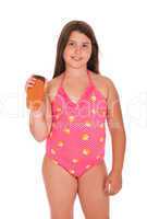 Girl in swimsuit holding sun lotion