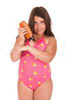 Girl in swimsuit applying sun lotion