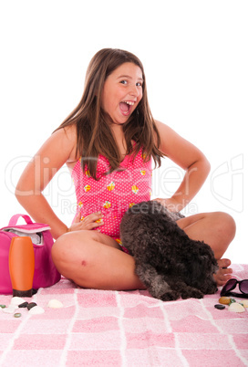 Girl in swimsuit at the beach with dog