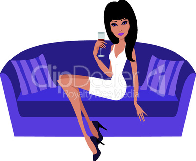 Young woman with a wine glass sits on a sofa