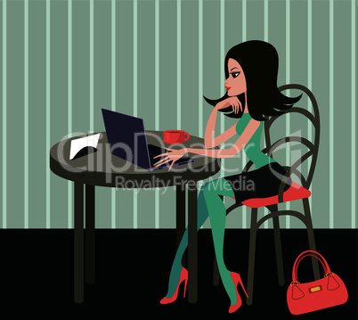 Young woman with the laptop in cafe