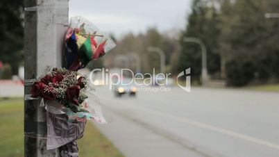 Cars Pass By Roadside Accident Memorial Scene