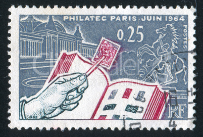 Book and hand with the stamp