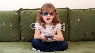 little girl with 3d glasses play video game