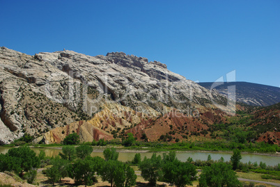 Multicoloured sands and rocks with green River valley, Wyoming