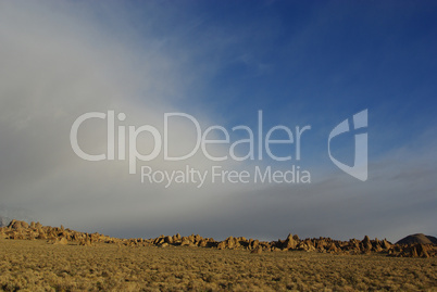 Fog and blue sky on Alabama Hills, California